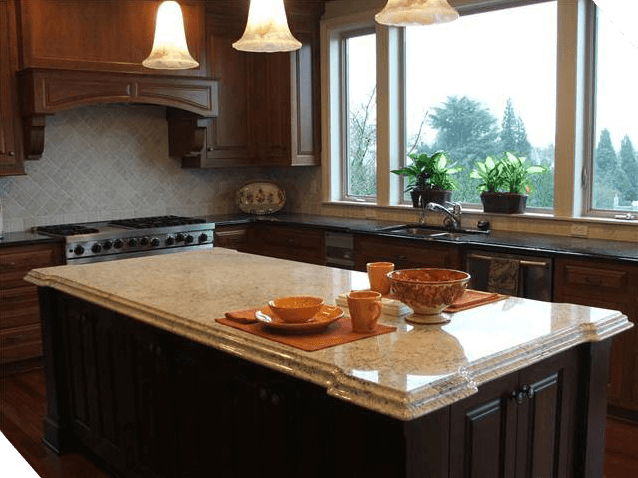 A kitchen with a granite bar and some plates on it